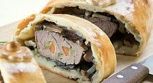Рецепт - Нашпигованная свинина с грибами