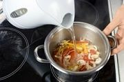 Приготовление блюда по рецепту - Суп с форелью по-гречески. Шаг 5